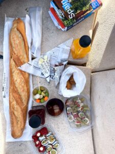 Baguette, olives, sardines and juice for lunch.