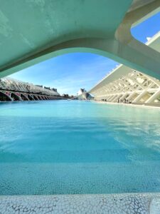 Pool and white buildings in futuristic architecture style.
