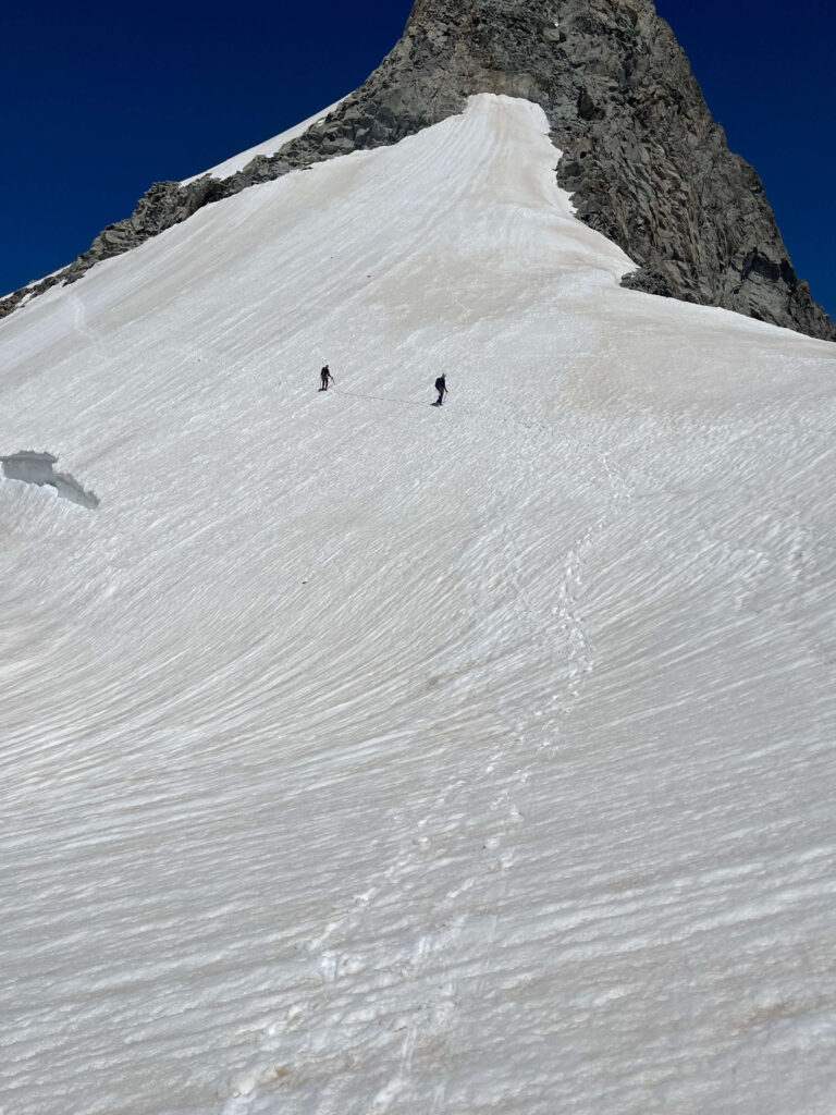 Descending Mont Dolent's snow capped face.