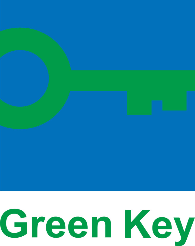 A green key on a blue background.