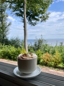 Hot coco served with a view towards the sea