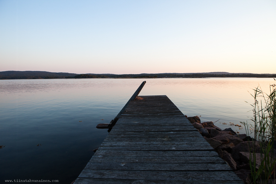 Wooden pier with calm waters in evening light