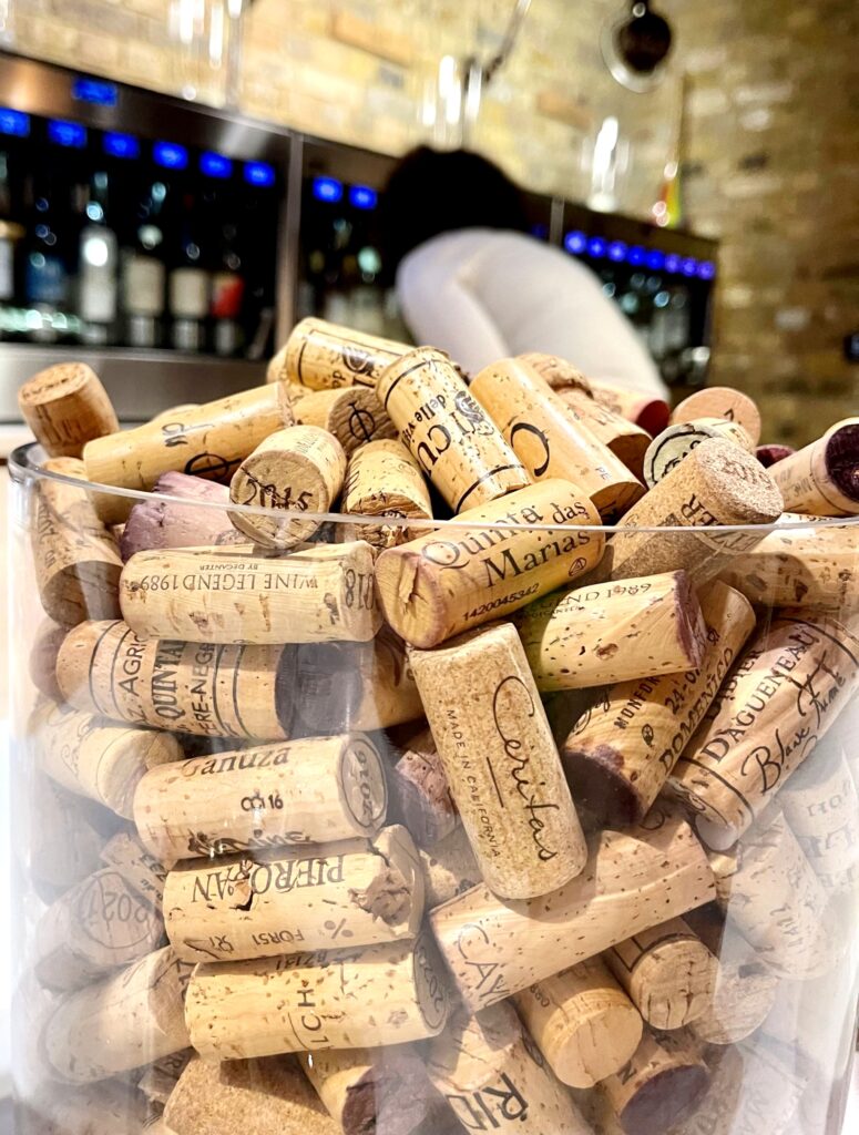 A glass jar filled with wine corks