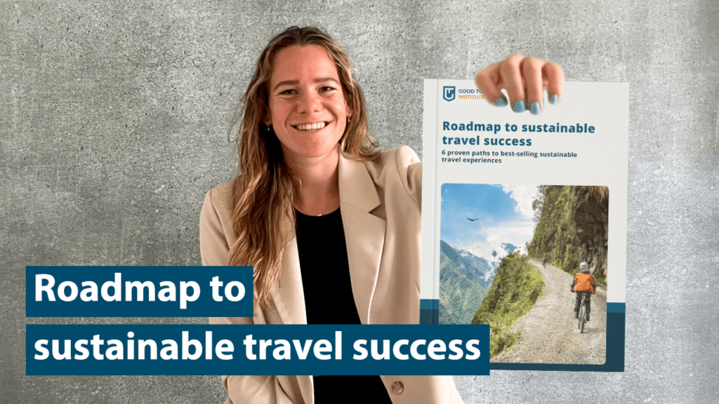 Anne de Jong from Good Tourism Institute holding a book on sustainable travel.