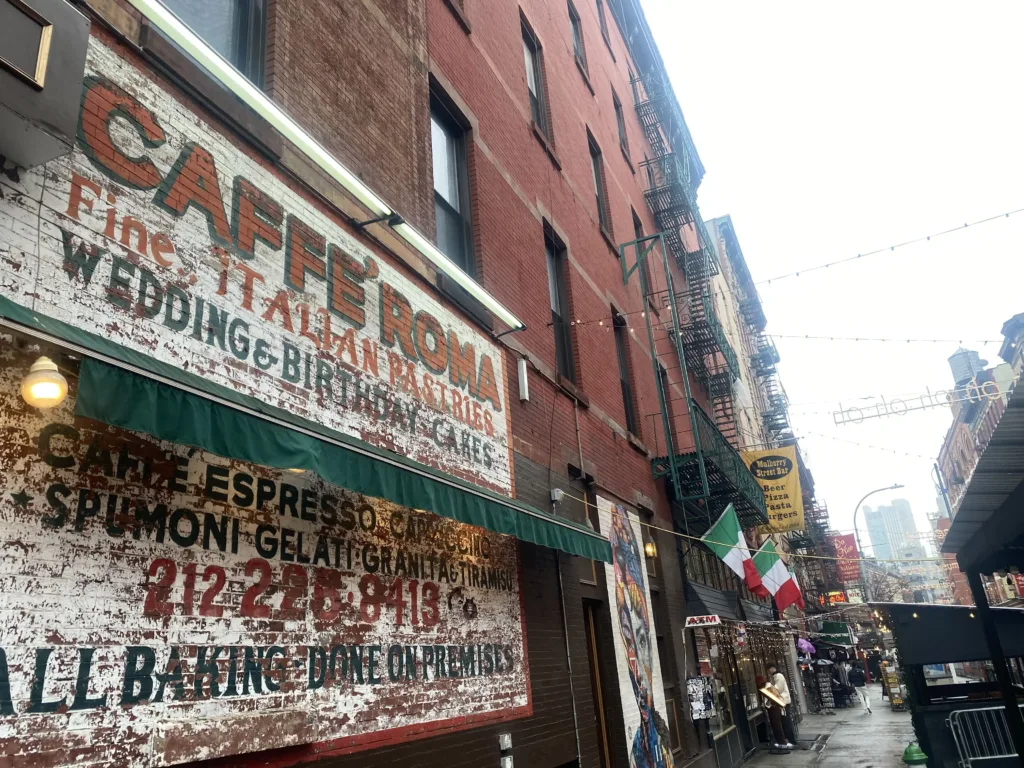 Shut storefront of Caffe Roma in Little Italy.