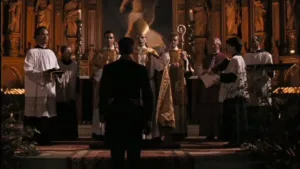The Godfather stands in front of the clergy.