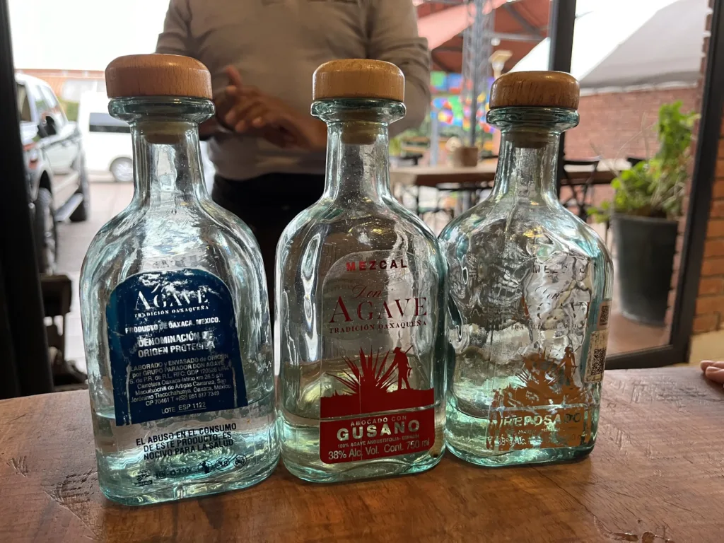 Three bottles of Tequila and mezcal.