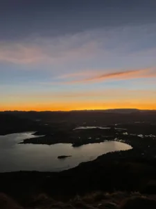 Sunrise from mountaintop with lakes below. 
