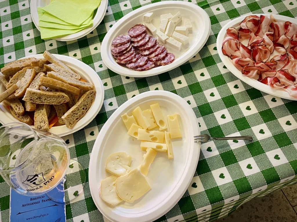 Table with cheese, bread and cold cuts