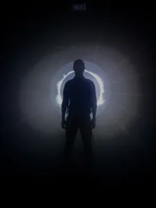 Man in front of light display