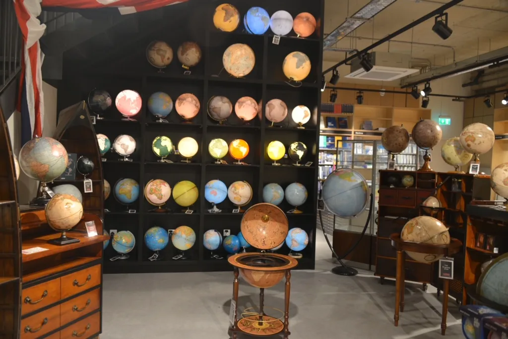 Display of globes in different sizes and with light fixture inside.