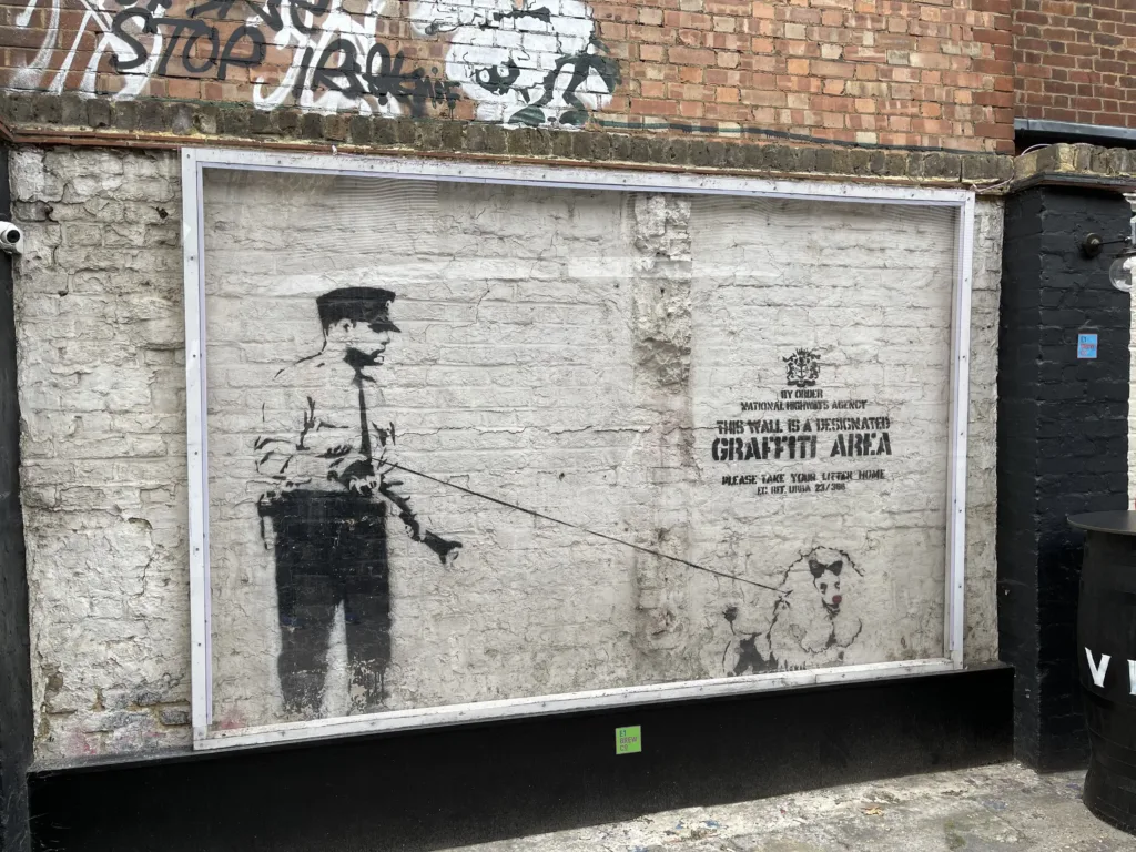 Mural of man with a sheep on a leash