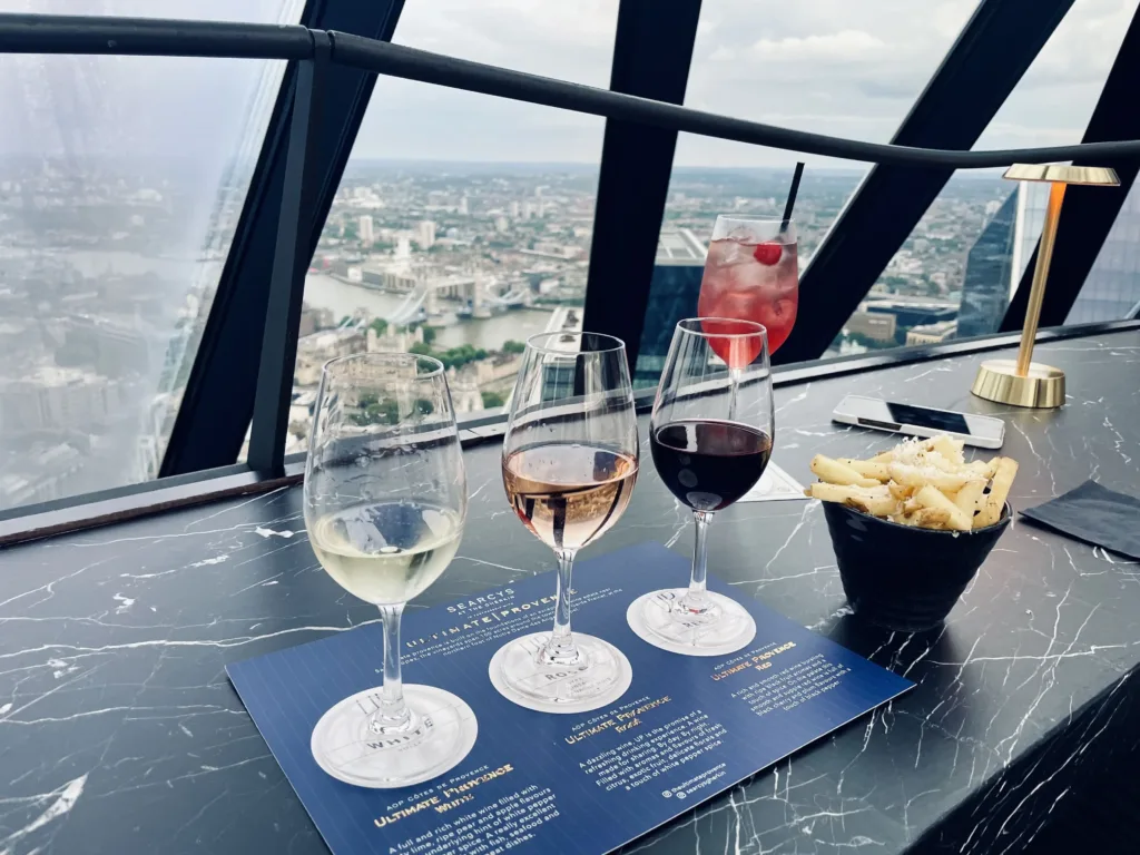 3 glasses of wine and a cocktail with a view over London