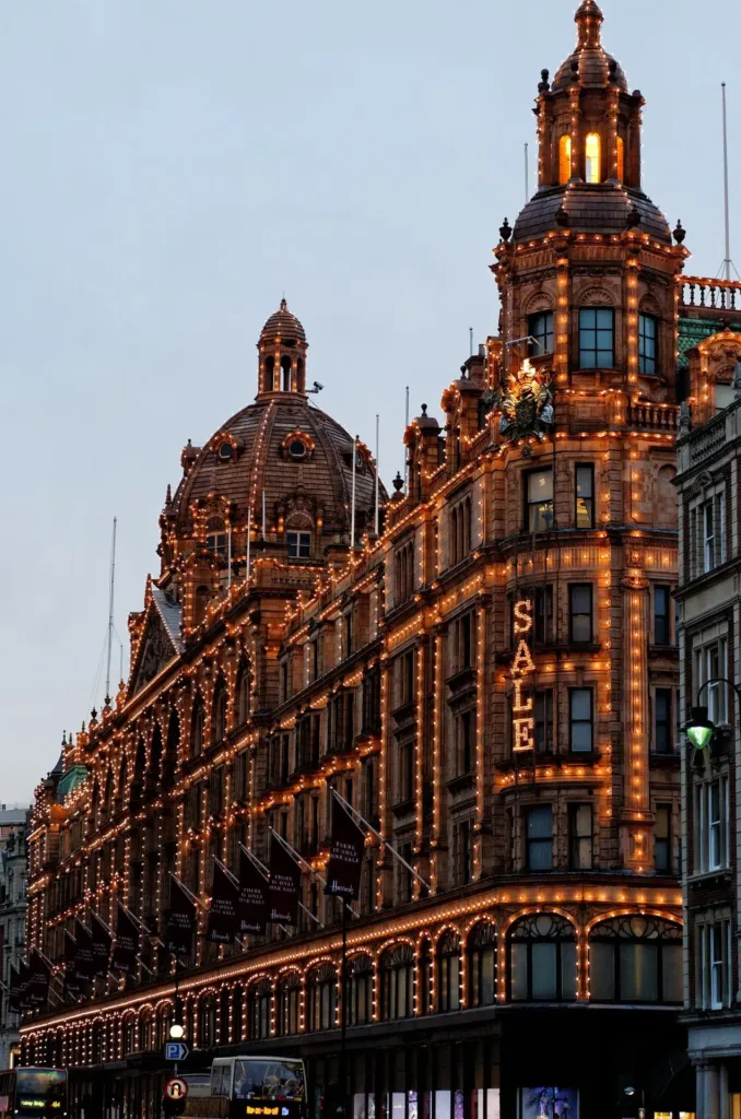 Lit department store front with dome in the middle.