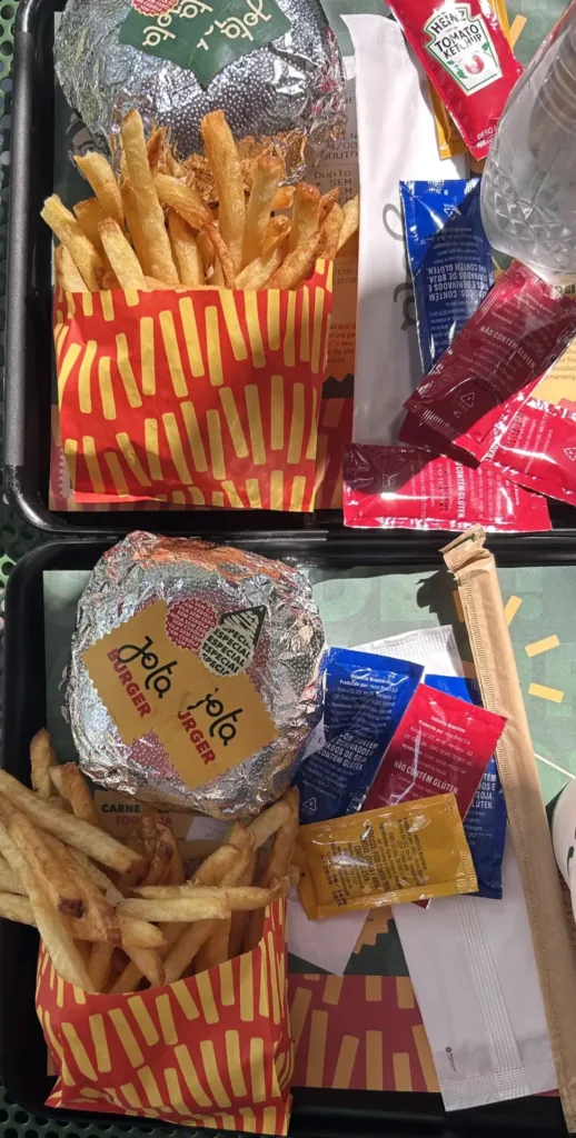 Two trays with burger and fries