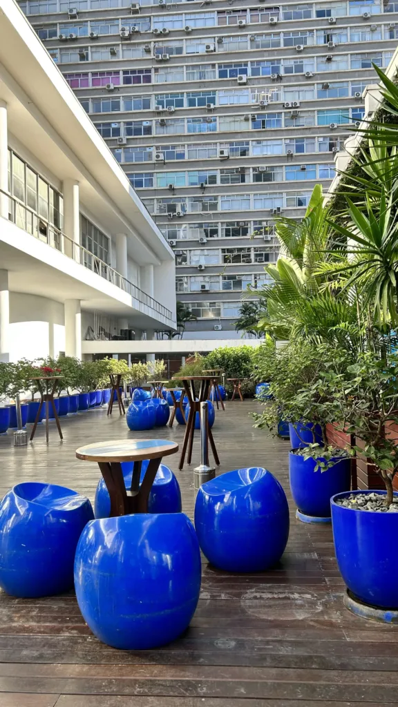 Blue outdoor seating among buildings