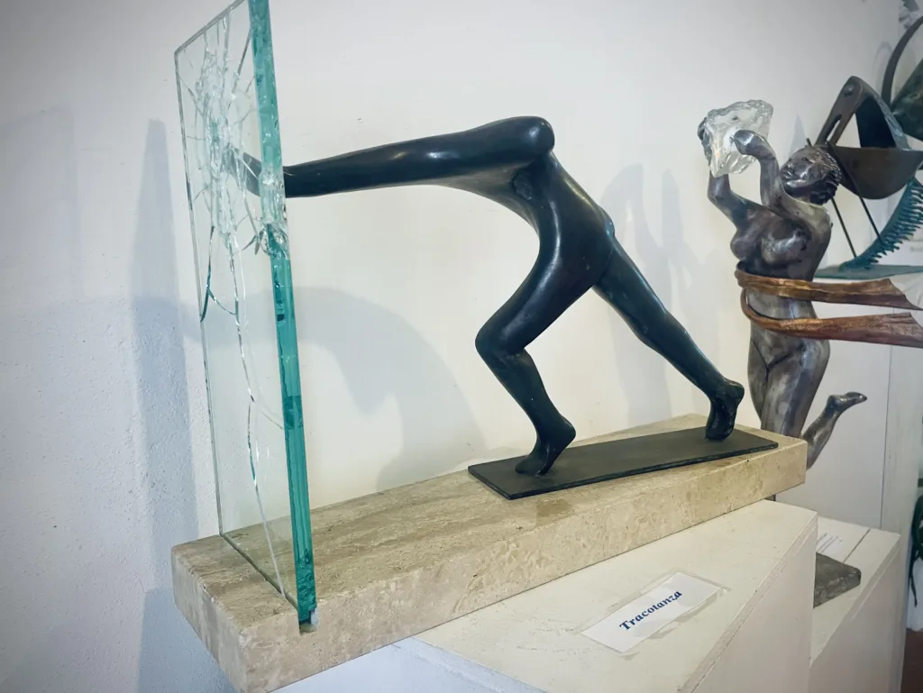 Sculpture of a man cracking glass