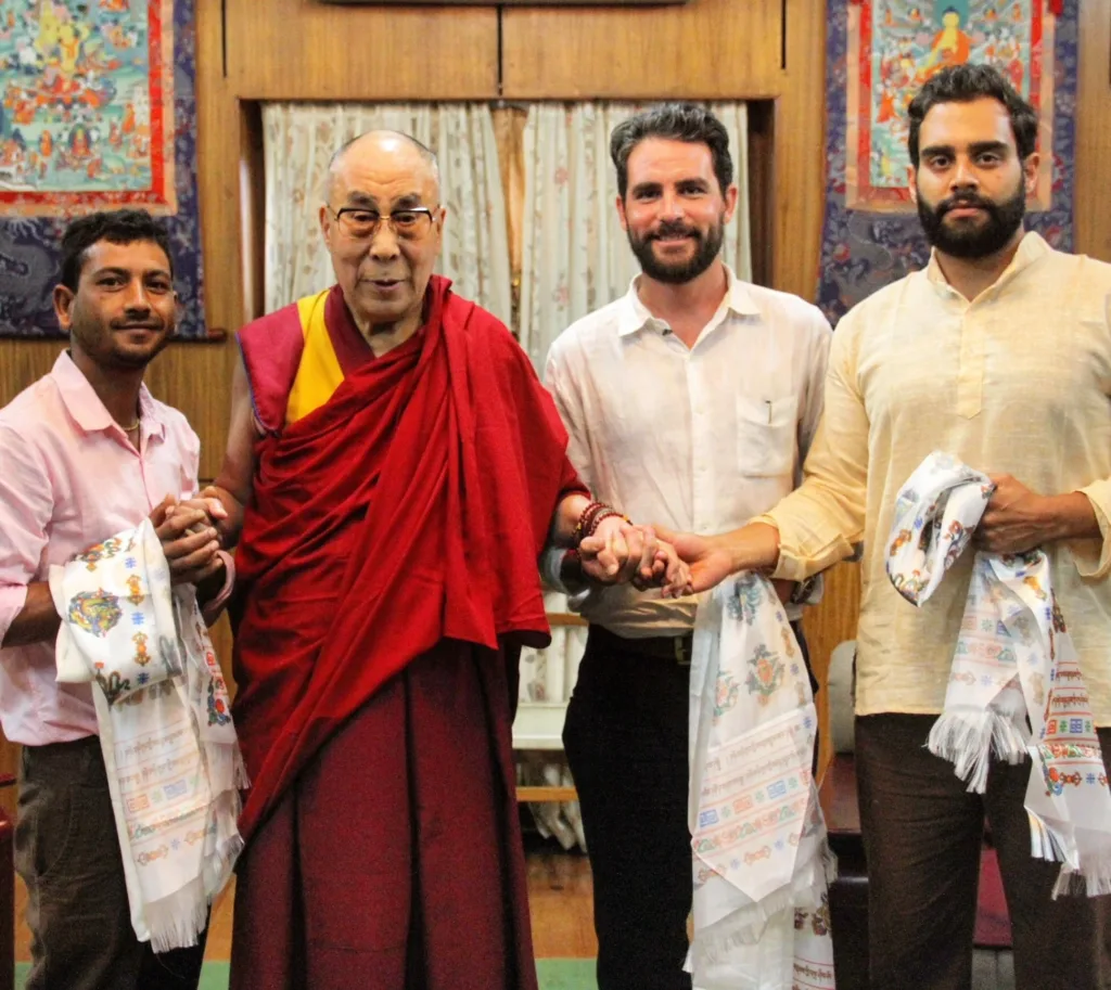 4 men in group picture including Dalai Lama