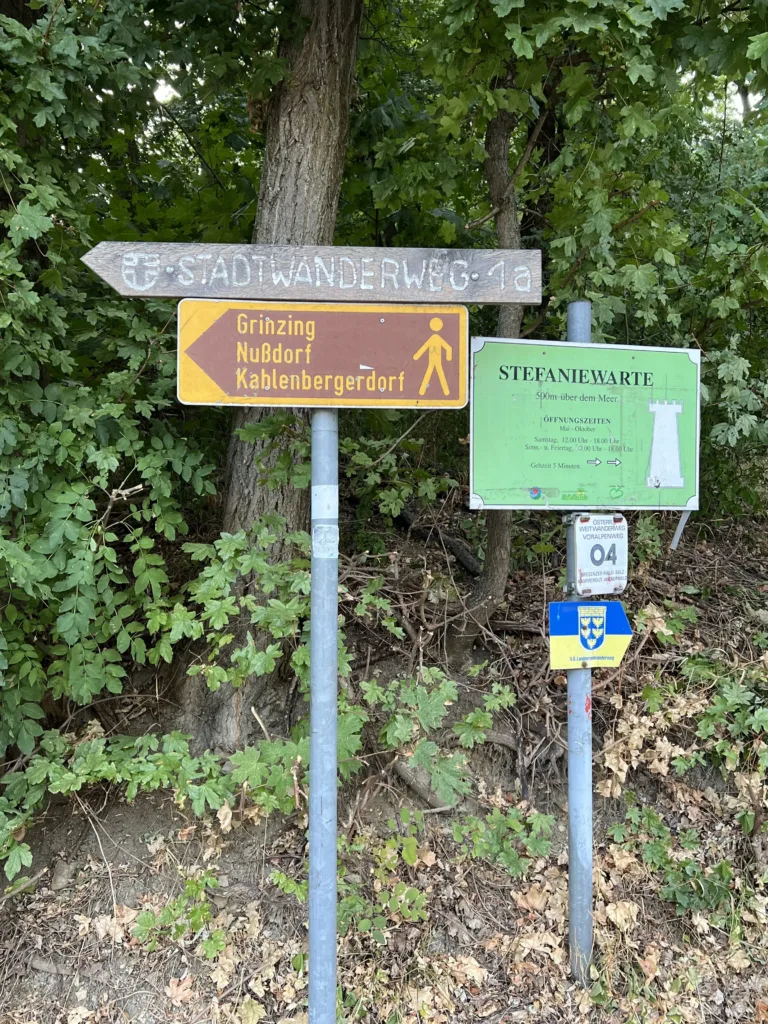 Two hiking signs in a forest