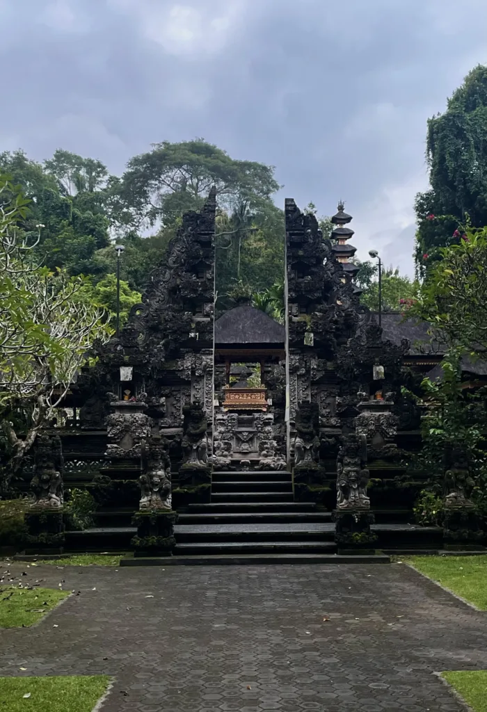 Paved entrance and stairs to temple in black stone