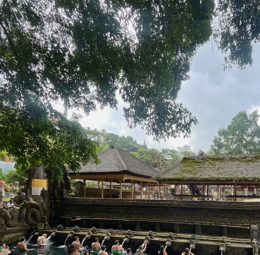 Water reservoir with people cleansing themselves via piped water