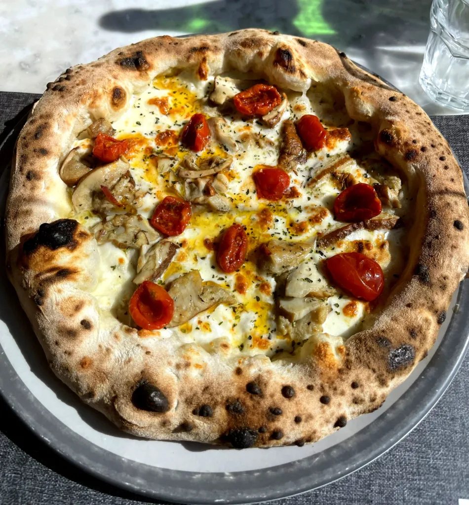 Pizza with tomatoes, cheese and mushroom