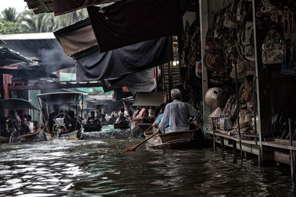 Small boats near a busy river market