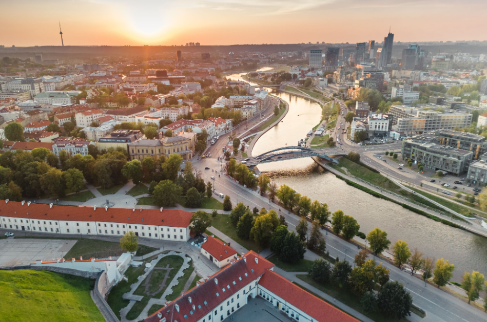 River running though a city with trees and buildings