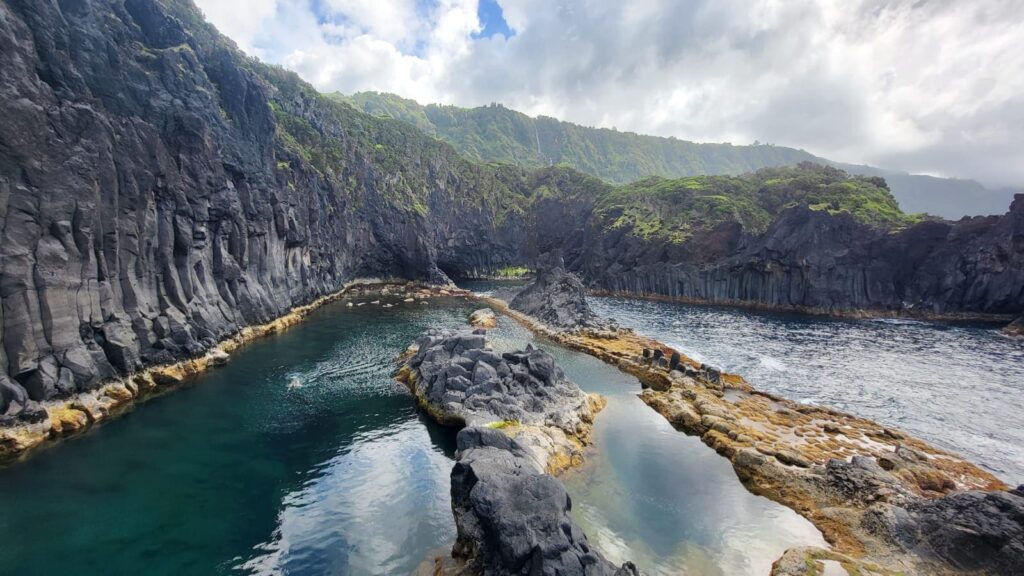 Green blue water lake in mountain setting.