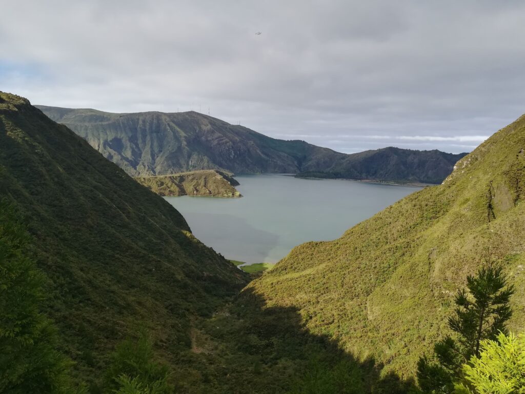 Lake between verdant mountains