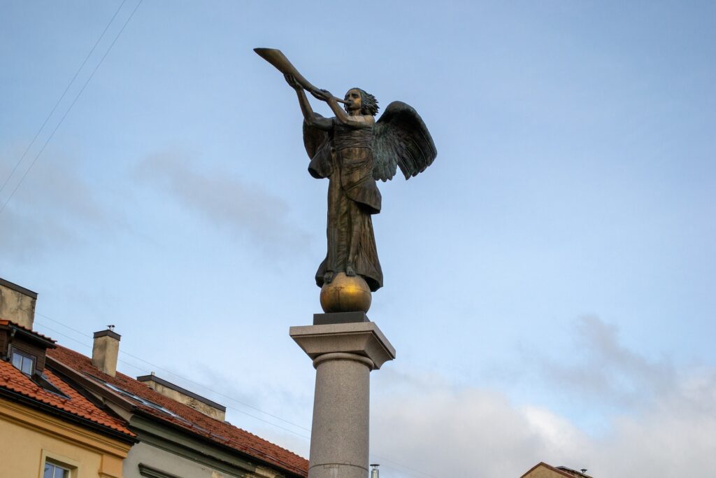 Statue of angel blowing a horn