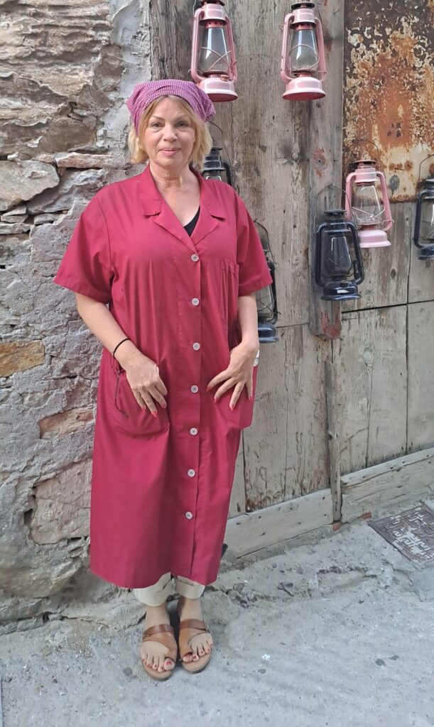 Woman standing in front of a wooden door