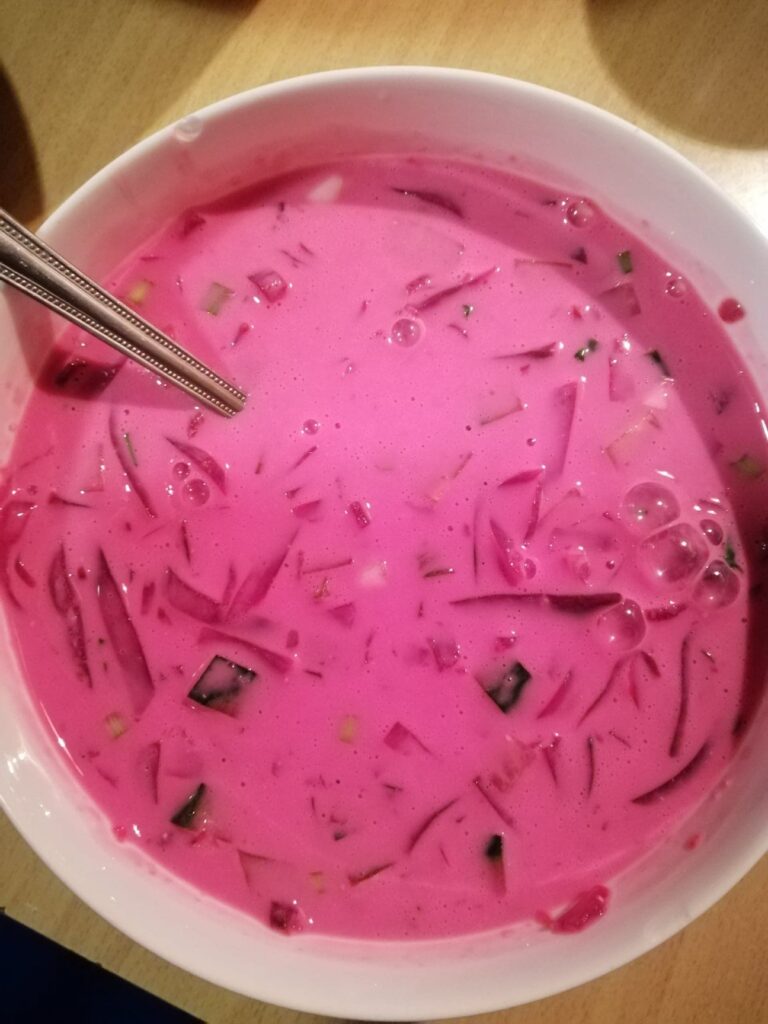 Beetroot soup in a white bowl