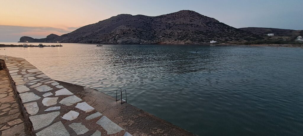 Swimming platform in a cove with mountain on far side