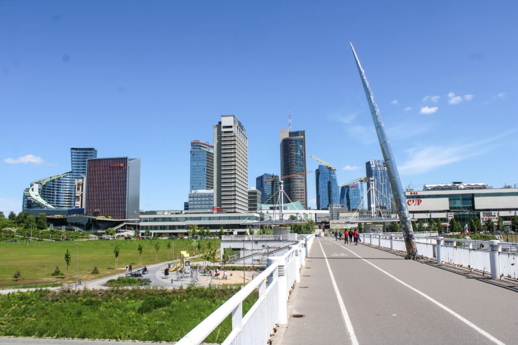 High-rise buildings seen from a walking path and green area