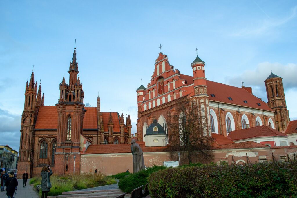 Red bricked church complex with turrets.