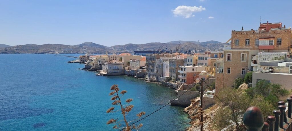 View of buildings lapping the blue sea