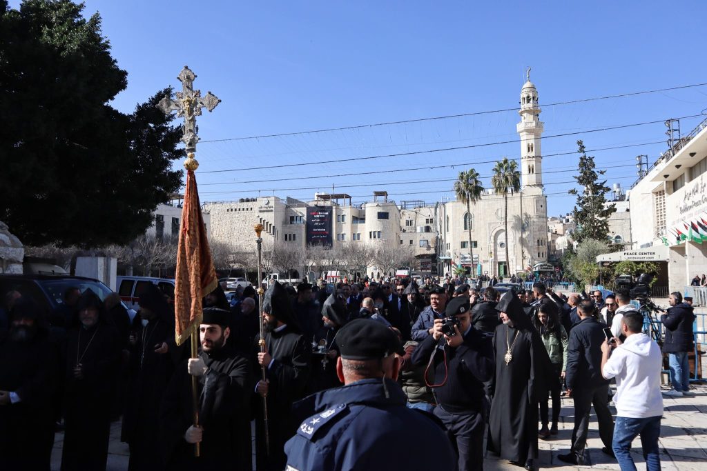 Group of people in procession.