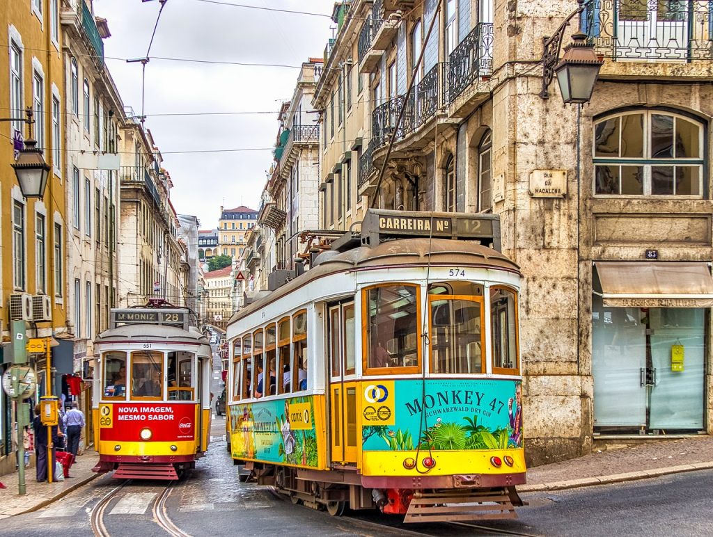 Two trams meeting on a narrow street.