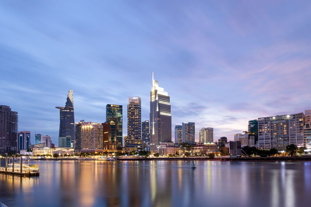 Cluster of skyscrapers seen from across a river.