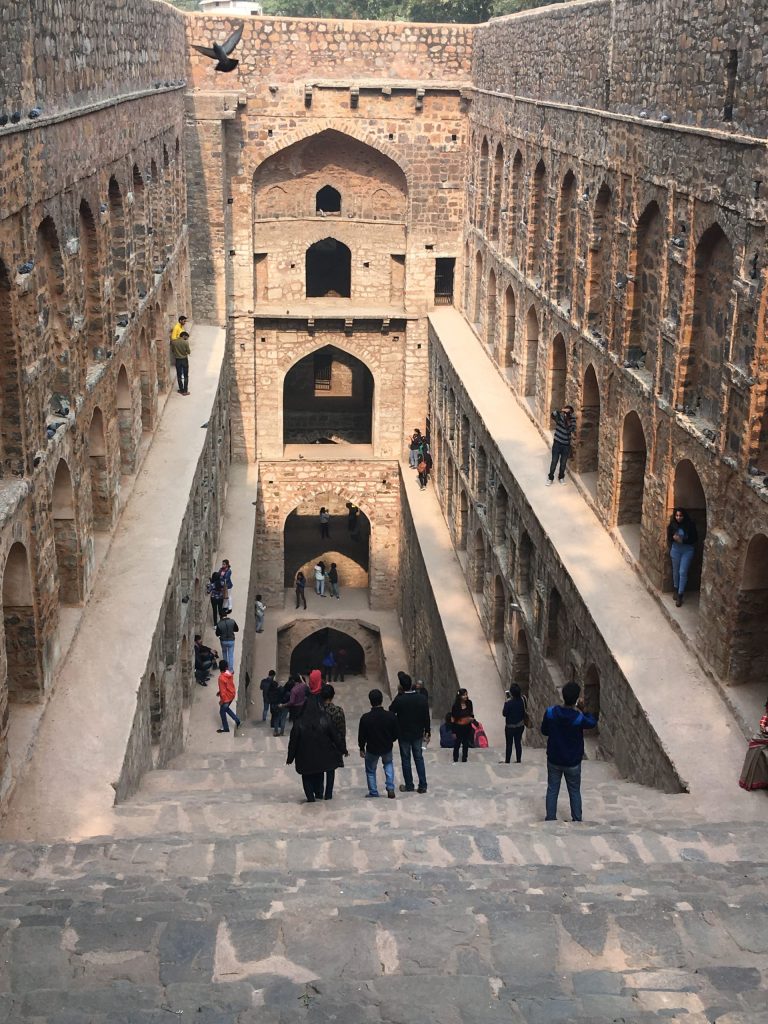 Huge stepwell with people walking on different levels