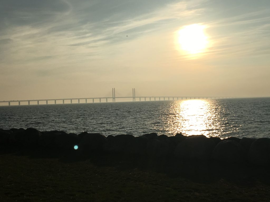 Bridge on the horizon as sun sets