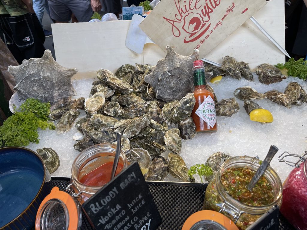 Display of oysters, ice, and condiments