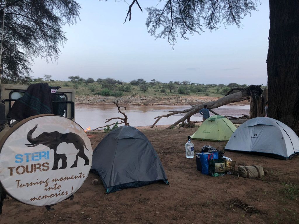 Tents by a river
