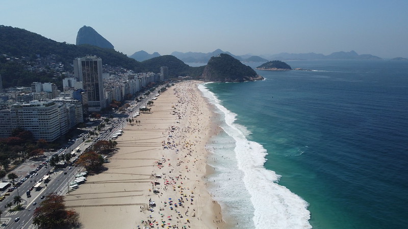 Long stretch of beach with buildings lining the sand