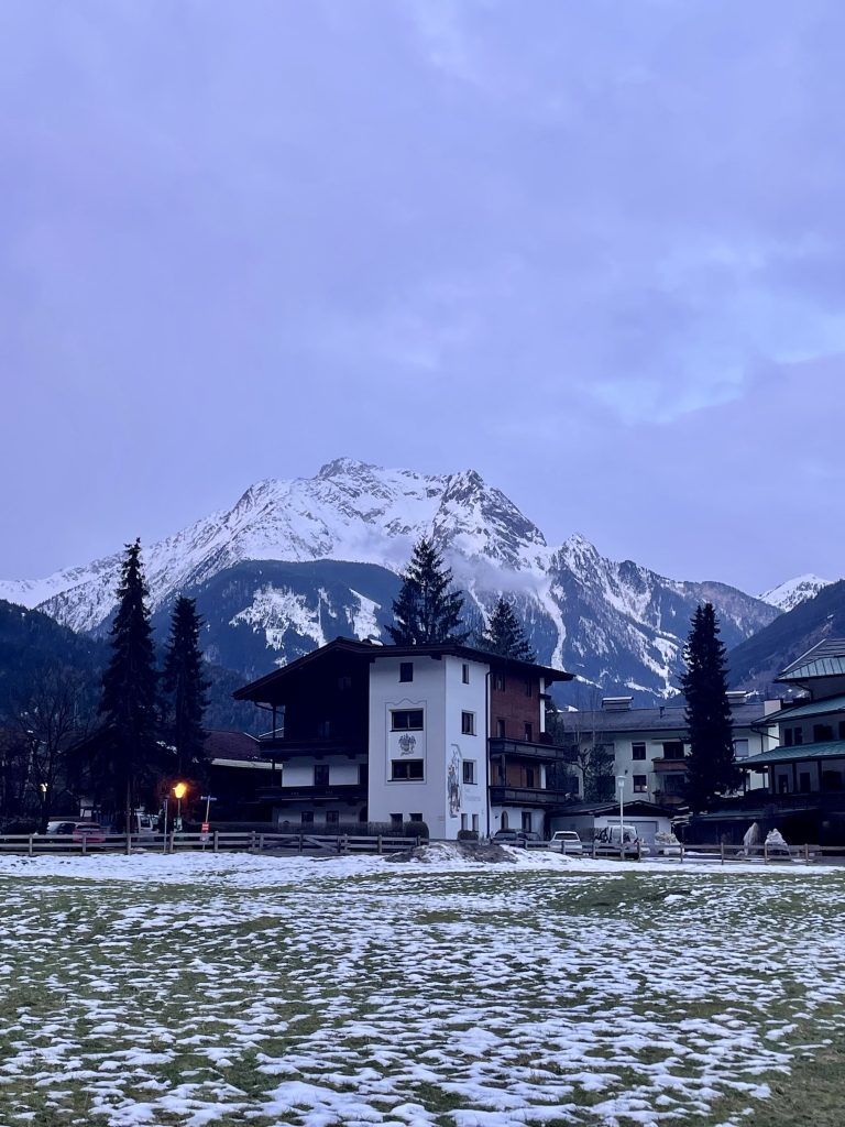 Snow-capped mountain with chalets in the foreground