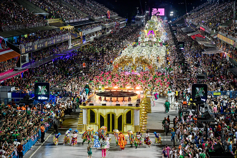 Parade procession with audience in stands on either side