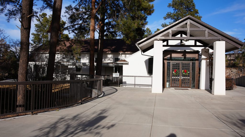 Entrance to single floored church among trees