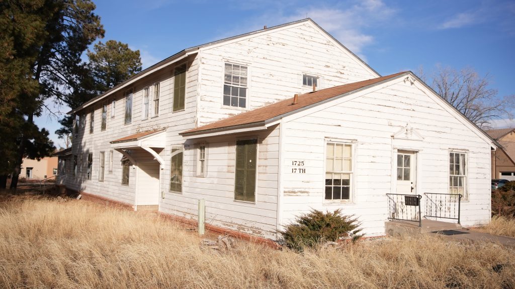 Two floored white dormitory builing