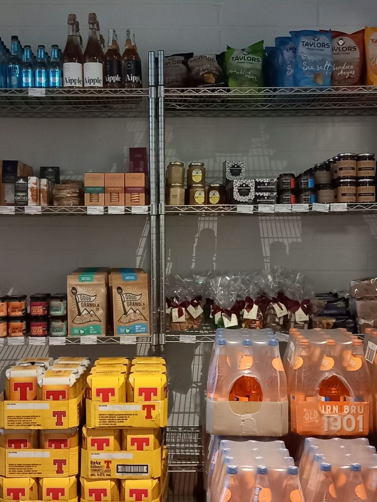 Shelves stacked with food and drink